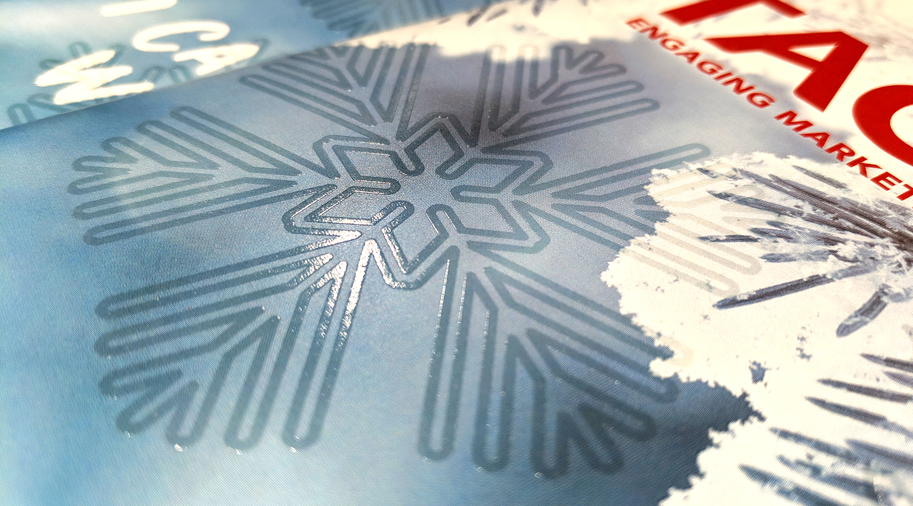 Raised print applied to snowflake on cover of Tactics Magazine